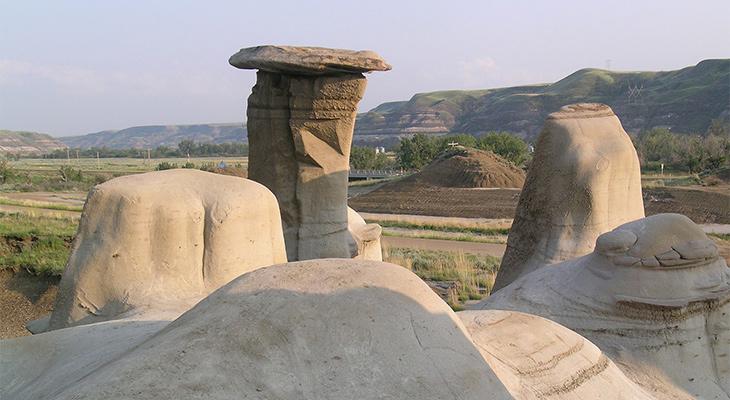 Hoodoos in the foreground of a badlands landscape. 